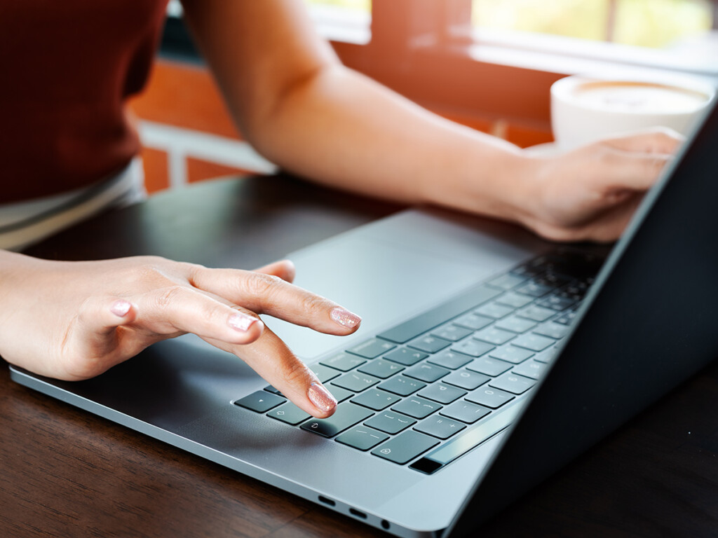 Woman hands office worker typing on the Enter keyboard