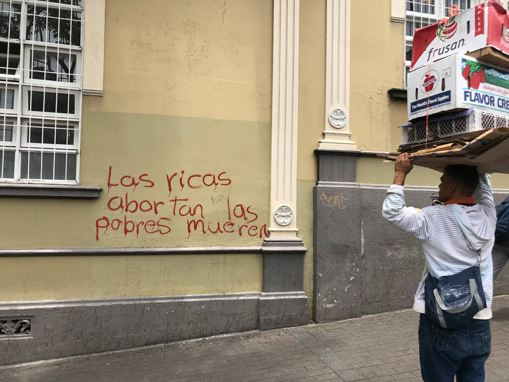 Graffiti on a building which reads, ‘The rich abort, the poor die.’ (Photo: Megan Rivers-Moore)