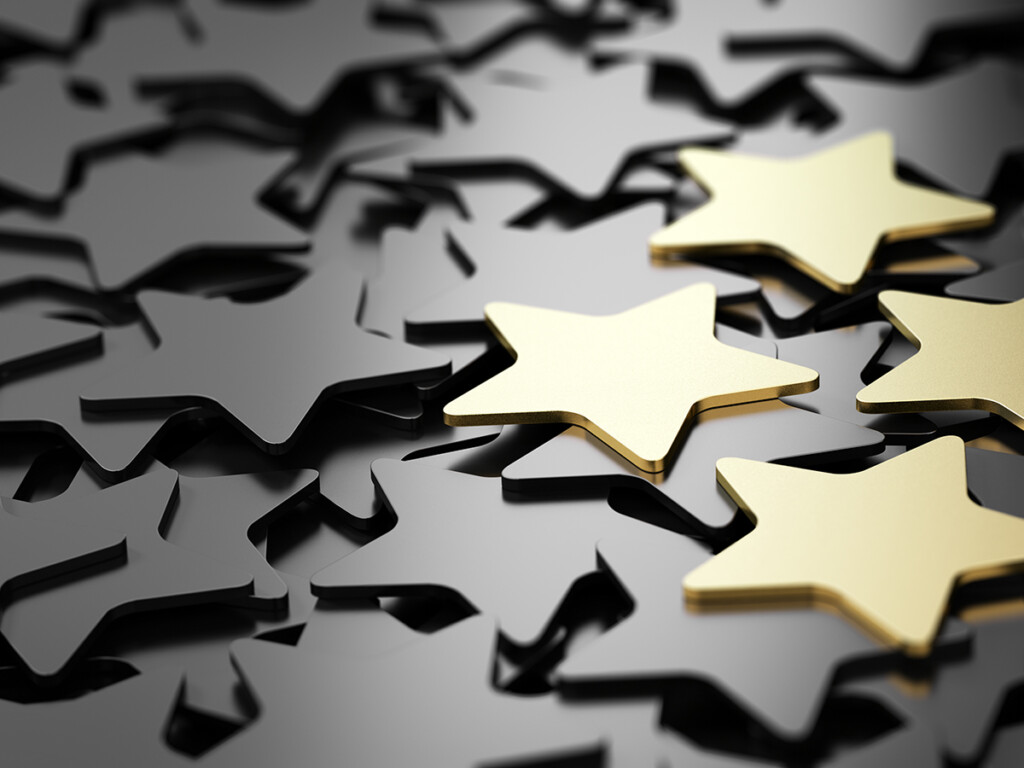 An image featuring gold stars to represent medallists