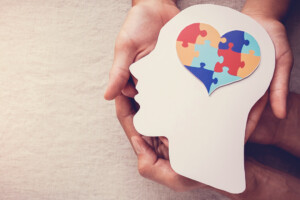 Puzzle jigsaw heart on brain, mental health concept
