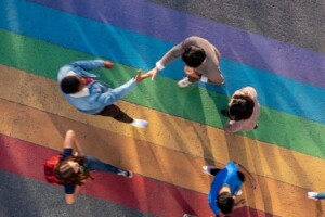 Students walking on the rainbow road located on the Carleton campus