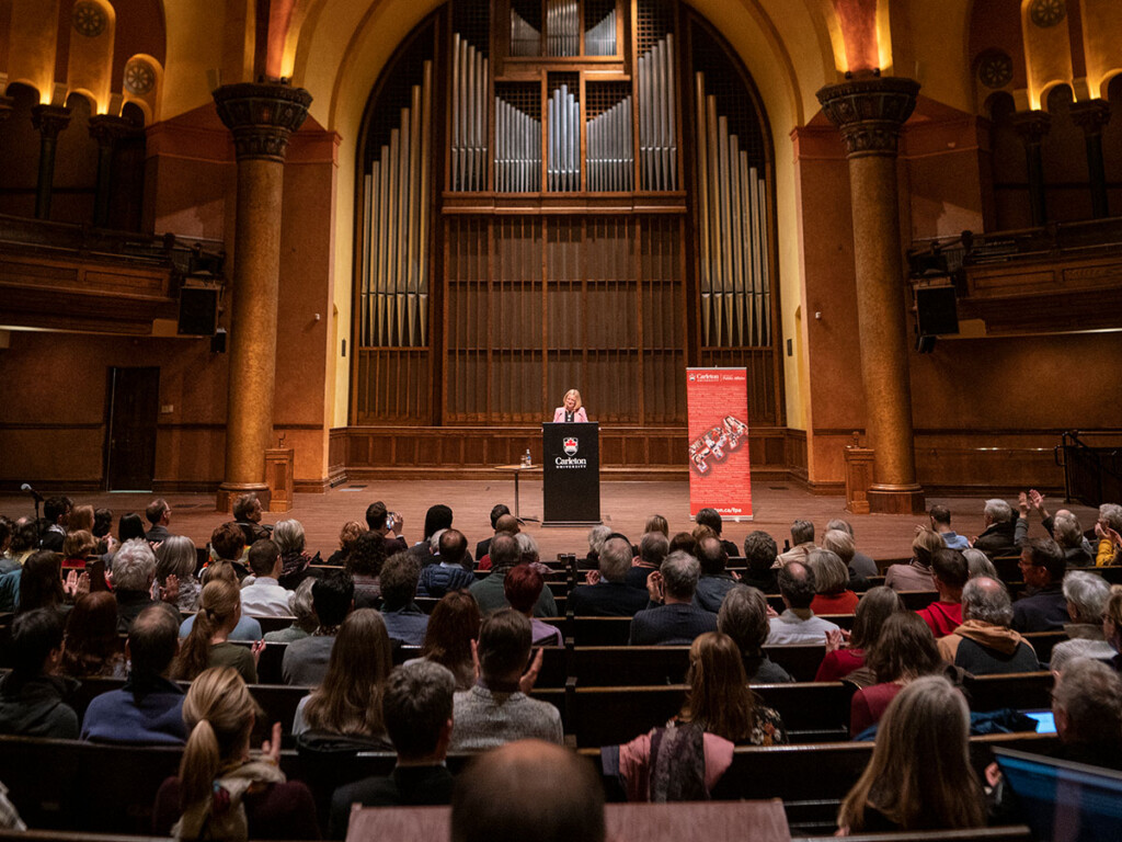 Rachel Notley addresses the crowd from a podium
