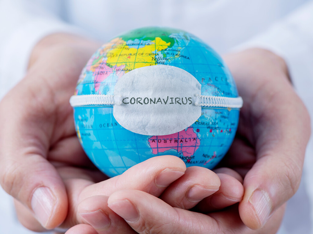 Globe with a mask that says coronavirus