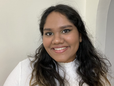 A young man smiles for the camera