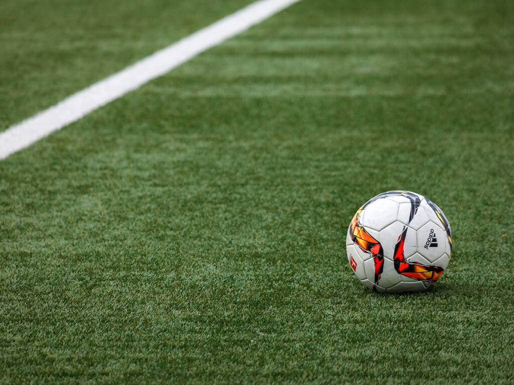 A soccer ball on a soccer field.