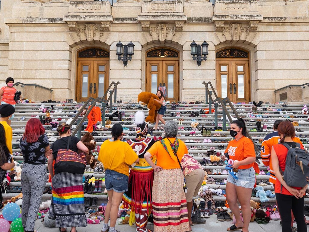 The scene of a memorial in front of an old building