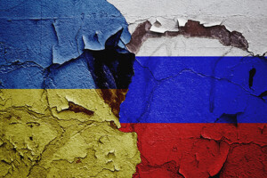 Combined flags of Ukraine and Russia with a tear in the middle