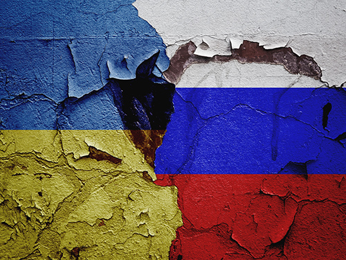 Combined flags of Ukraine and Russia with a tear in the middle