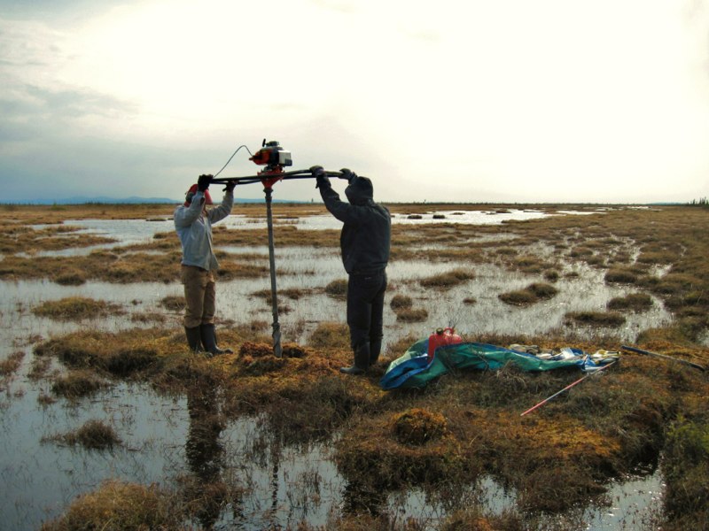 Zoë Braul & Ashlyn Frost extracting a permafrost core from a drained lake basin at Old Crow Flats, YT. 