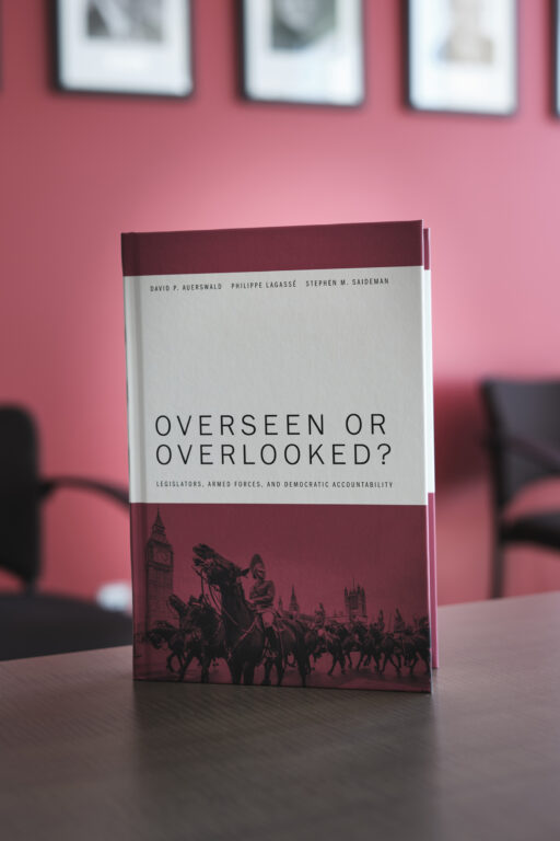 Overseen or Overlooked? book sits on top of a boardroom table