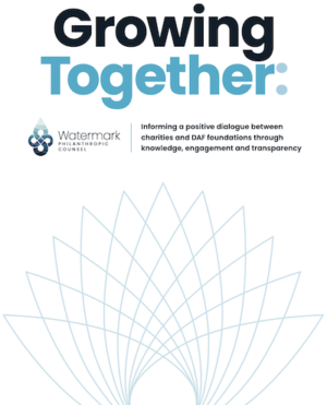 The cover of the DAF report, "Growing Together," features a design of a lotus flower and the logo of the Watermark company.