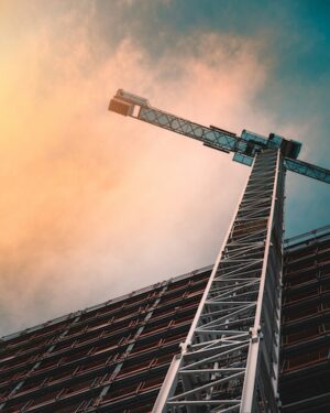 A construction crane towers into the sky.