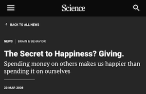 A screenshot from a Science website reads "Secret to happiness? Giving."