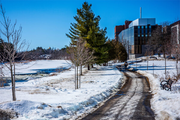 The campus pathway next to the Rideau River in winter.