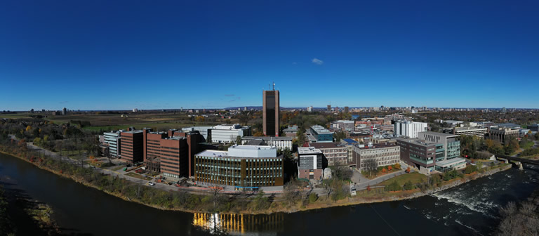 A view of Carleton's campus from the Rideau River.