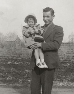 Black And White Photo of Samantha Maracle As A Baby Being Held By Her Father Garnett Maracle