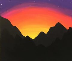 Image of silhouette mountains in the foreground with a yellow, orange, and purple sunset sky behind.