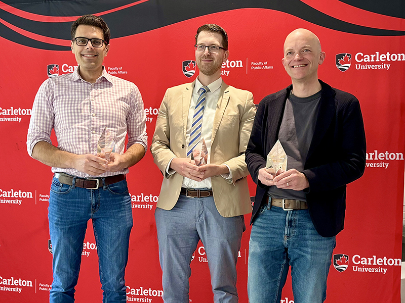 photo of Aaron Ettinger, Eric Van Rythoven and Achim Hurrelmann with their awards