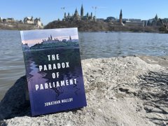 book cover with Parliament in the background