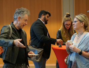 faculty engage in conversation at reception