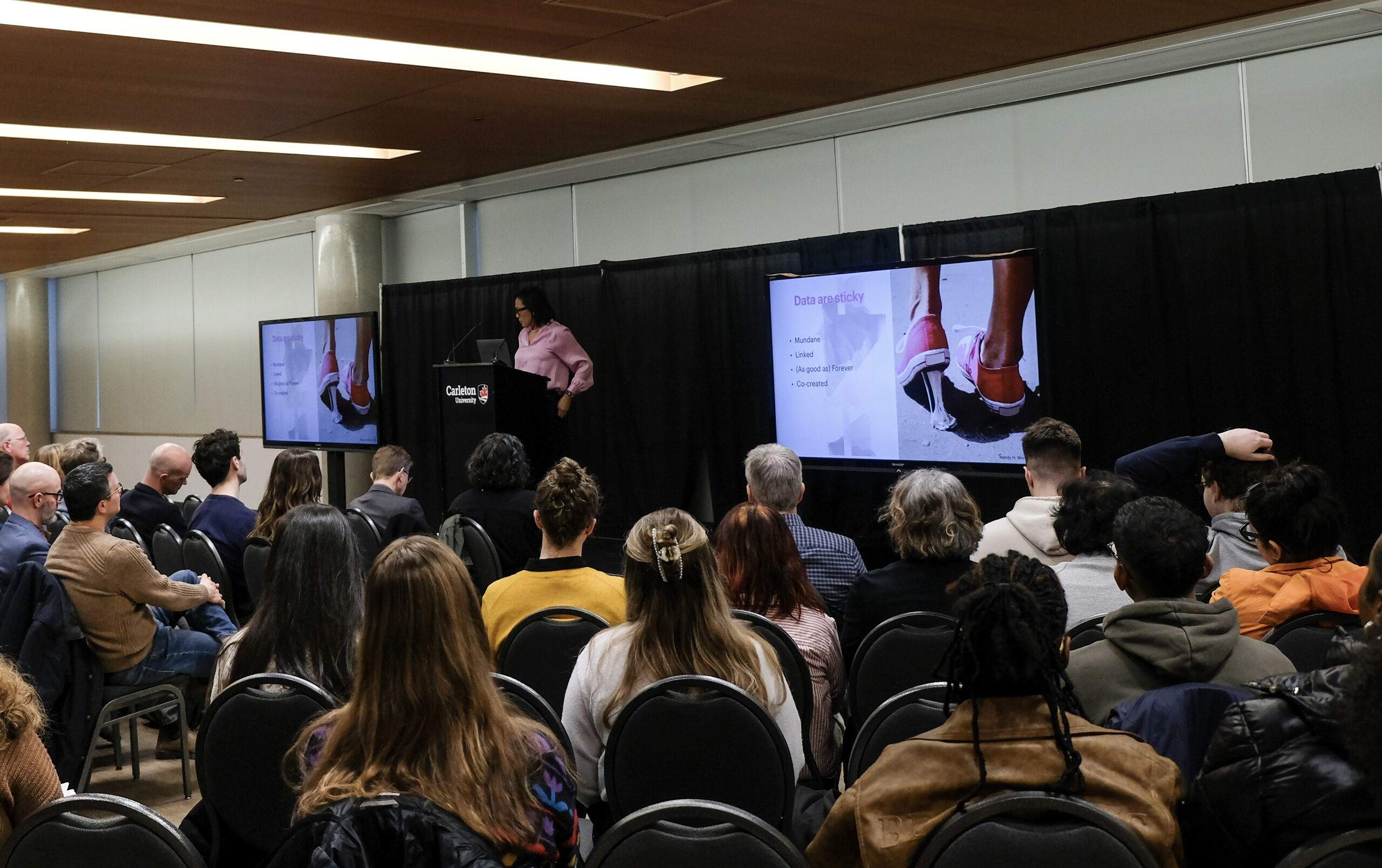 audience with speaker at podium