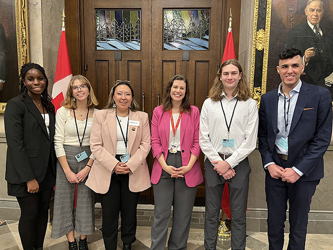 students in foyer of House of Commons