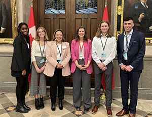 students in foyer of House of Commons