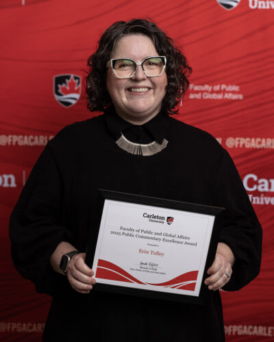 photo of Erin Tolley with research award