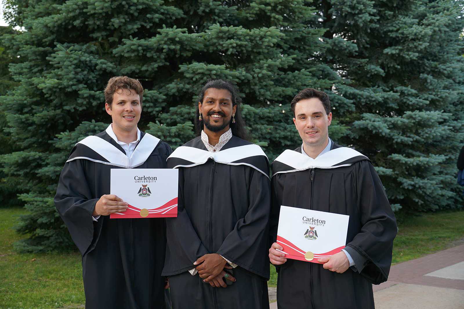 photo of MA Polisci grads Jordan Mclean, Ashwin Shantha and Gabe McDonald