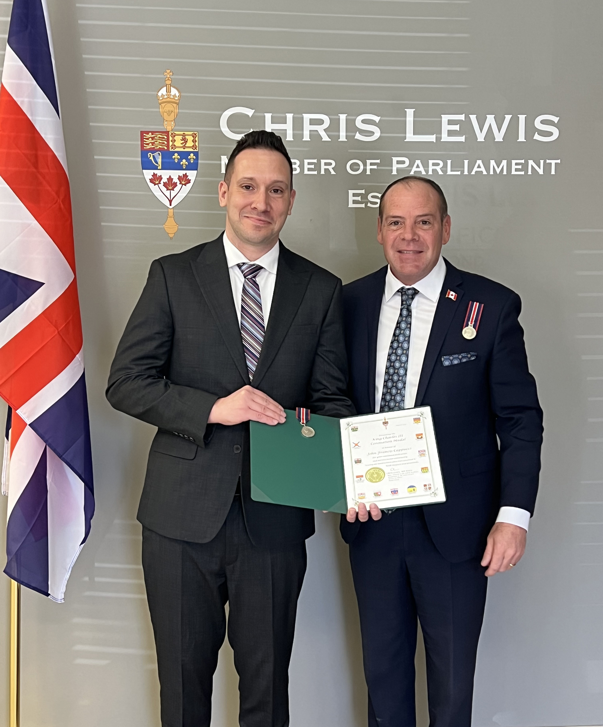 John Cappucci receives medal from MP Chris Lewis (Essex)