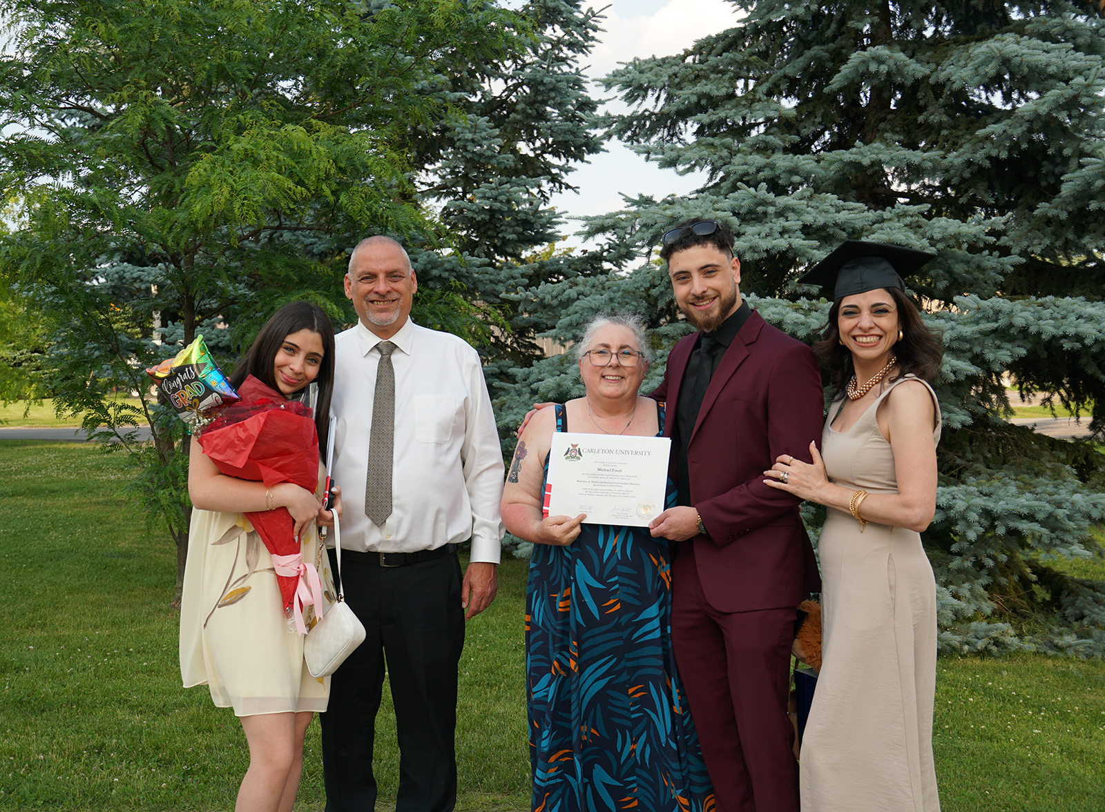 photo of Michael Farah and family with Undergrad 