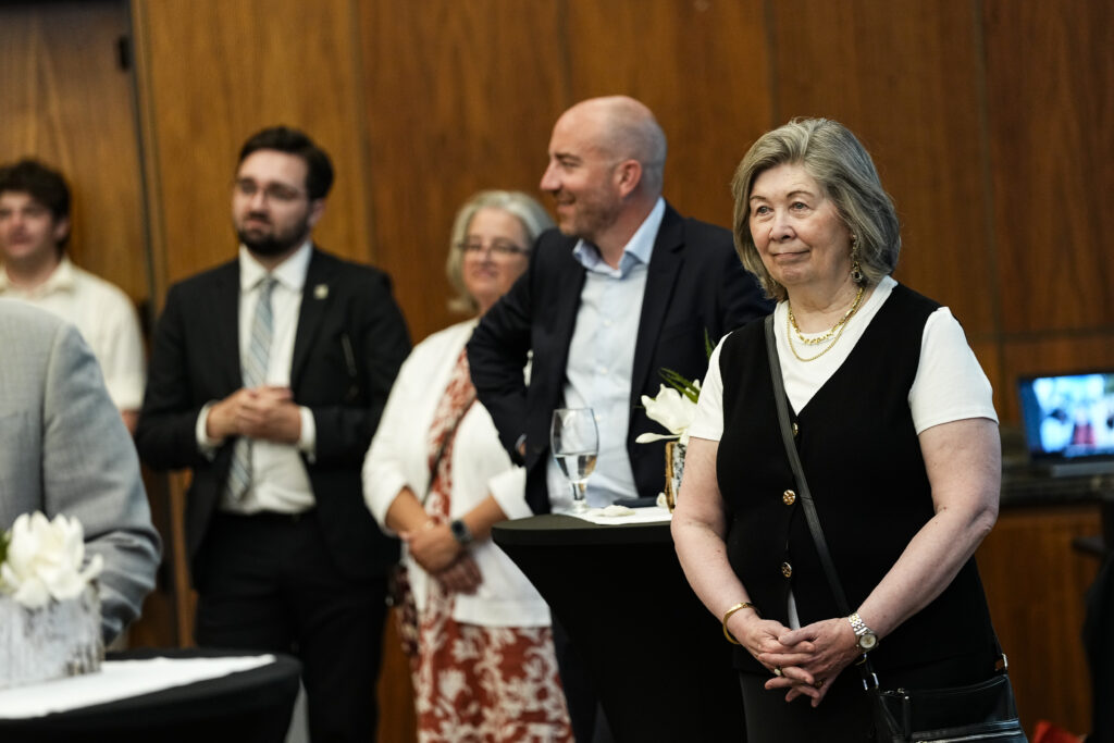 Guests listening to remarks at the reception hall