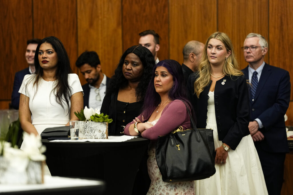 Guests listening to remarks at the reception hall