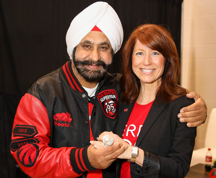 Nav “Superfan” Bhatia and Jennifer Conley, Chief Advancement Officer, pose for the camera