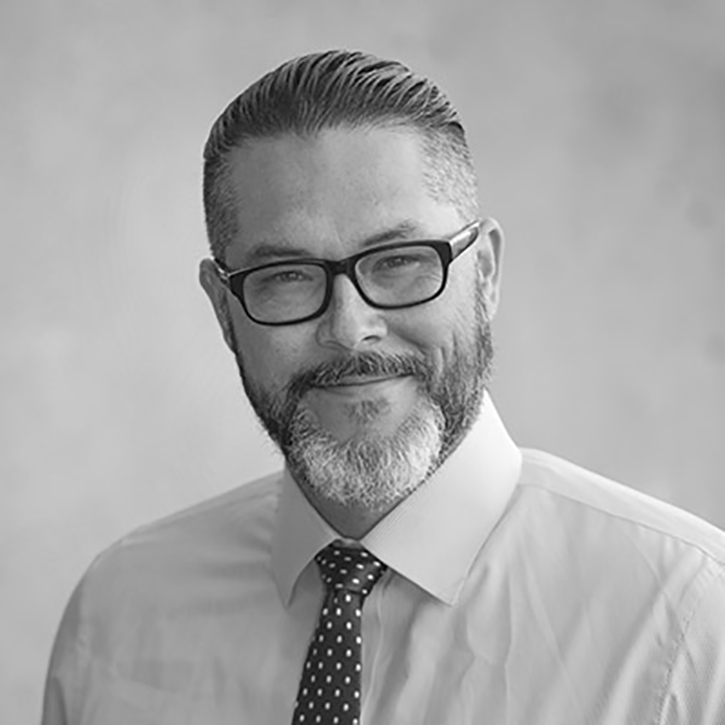 A black-and-white headshot of Joshua Shepherd