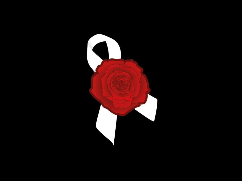 A ribbon and red flower to represent the National Day of Remembrance and Action on Violence Against Women