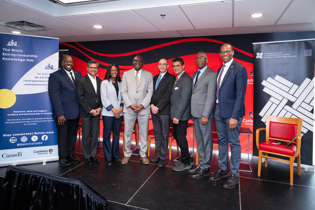 Members of the Black Entrepreneurship Knowledge Hub standing together on stage.
