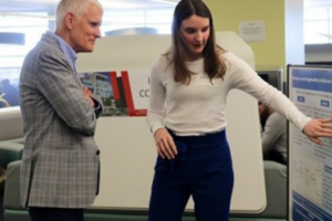 Commerce student Gemma Rod presents the research she completed at the I-CUREUS Conference to Provost Jerry Tomberlin