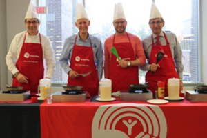 Carleton senior leaders serve pancakes at the Provost's Pancake Breakfast in support of United Way