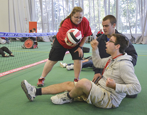 person trying sitting volleyball