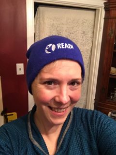 Cathy is smiling and wearing her READi blue beanie