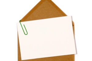 Graphic of a piece of paper affixed to an envelope with a paperclip