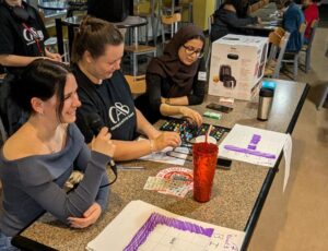 Bingo Callers working from a table.