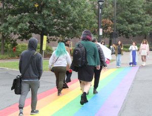 Pride Festival Committee Members walking down the new Pride Crosswalk.