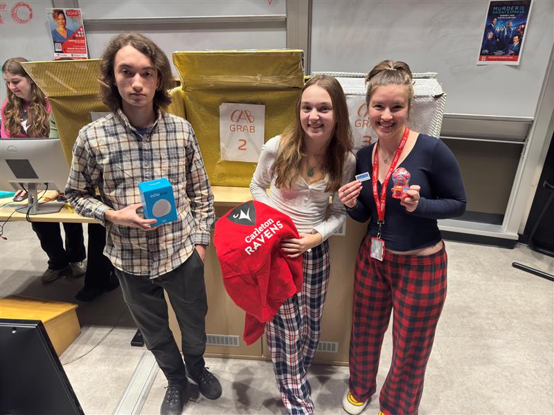 Students with prizes and the CAB Grab box behind them.
