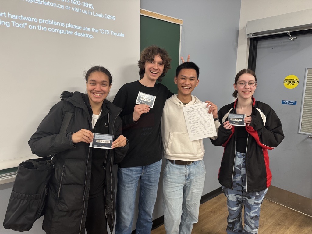 Group of students displaying their winning gift cards.