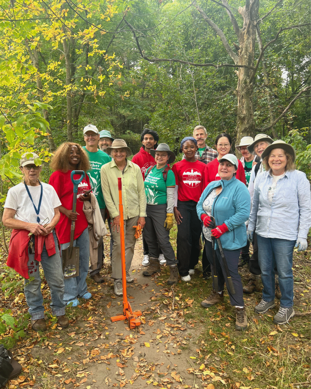 Students posing for a group photo outside while helping out with a Campus to Community event.
