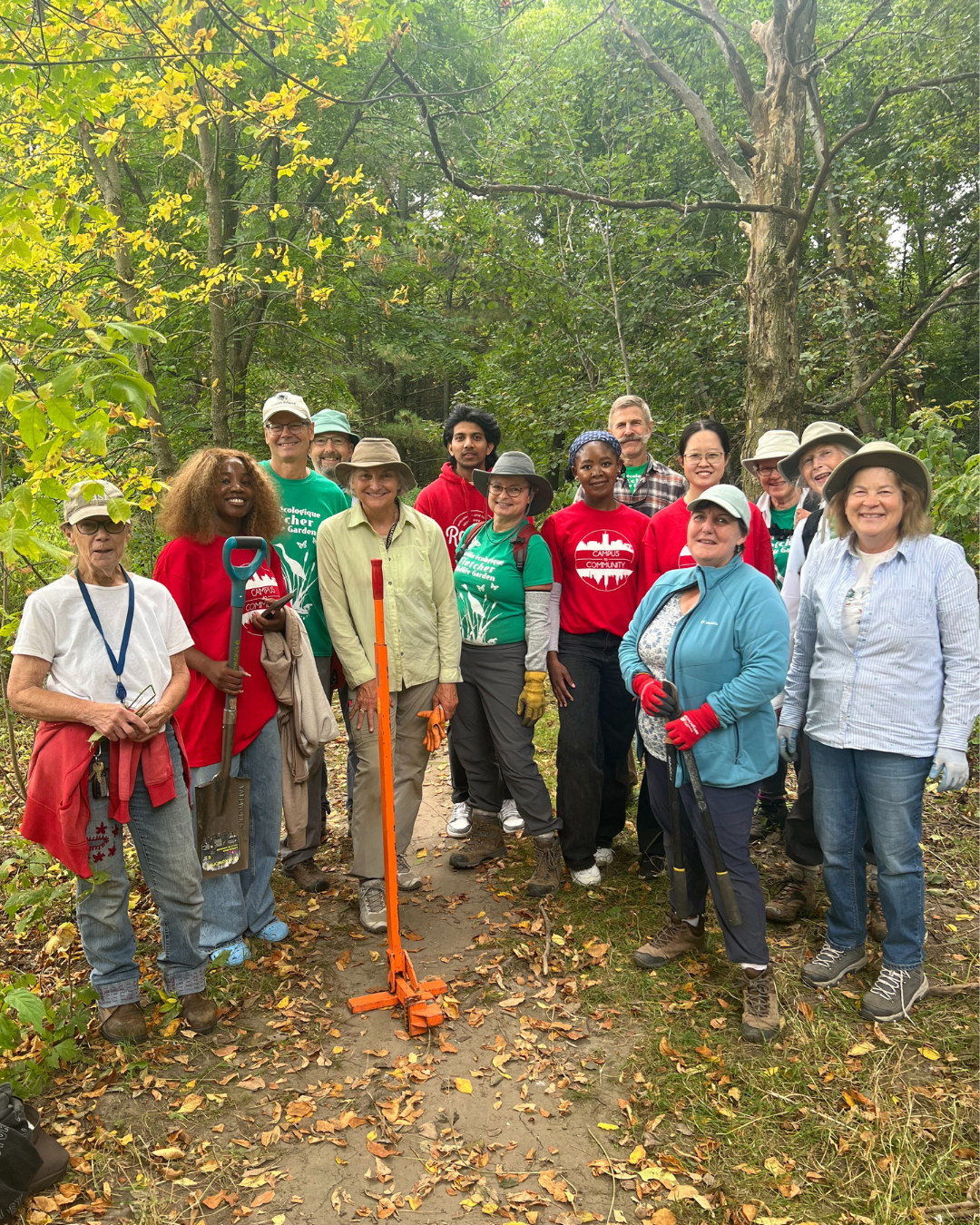 Students posing for a group photo outside while helping out with a Campus to Community event.