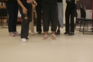 Students playing bean bag toss.