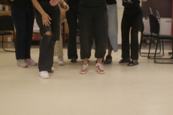 Students playing bean bag toss.